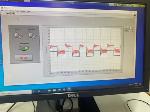 LabVIEW front panel showing the closed-loop speed rig tracking a square-wave reference: the motor output follows the commanded steps each period.